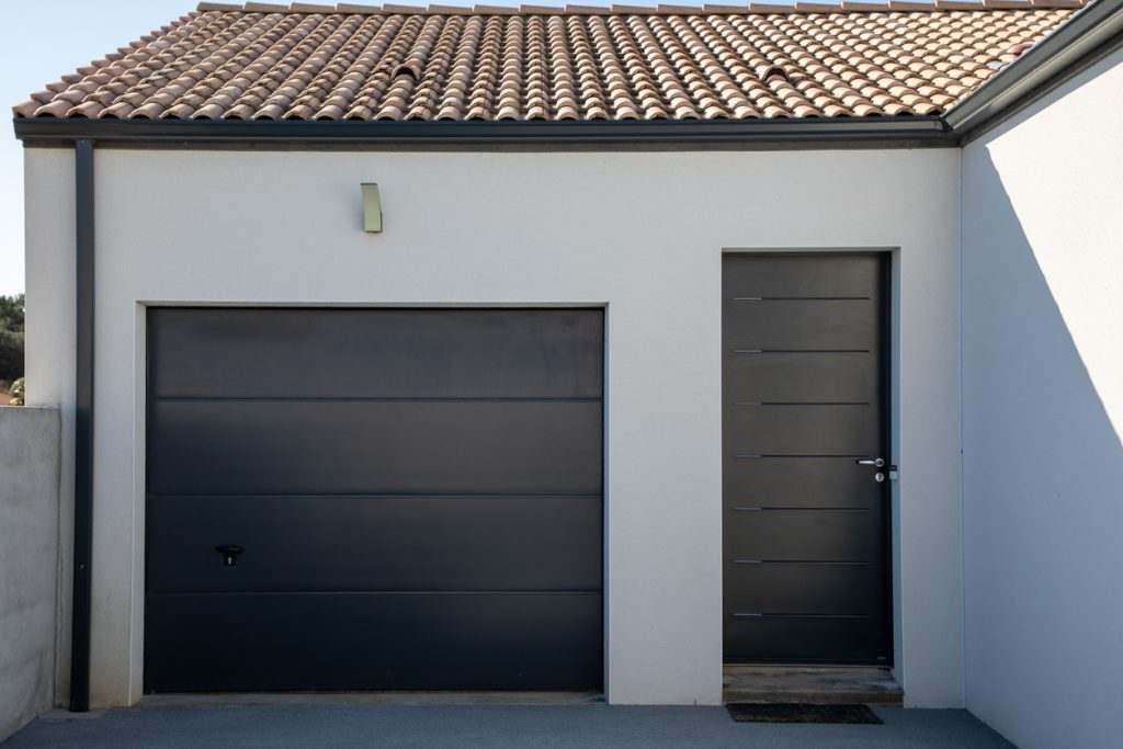  grey door of suburb house entrance garage home